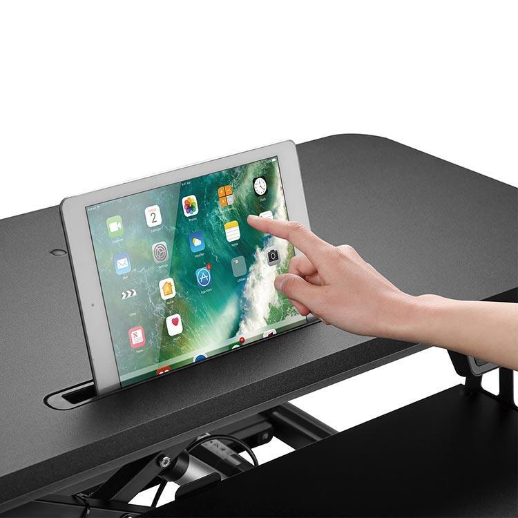 The electronic device holder in the Flexus E Electric Standing Desk Converter.
