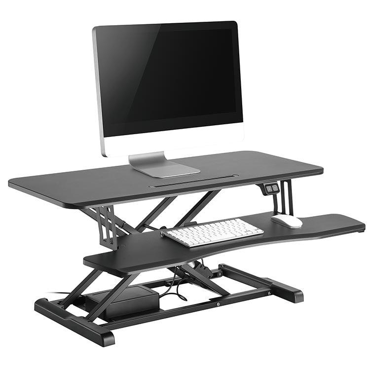The Flexus E Electric Standing Desk Converter with computer, angle view.