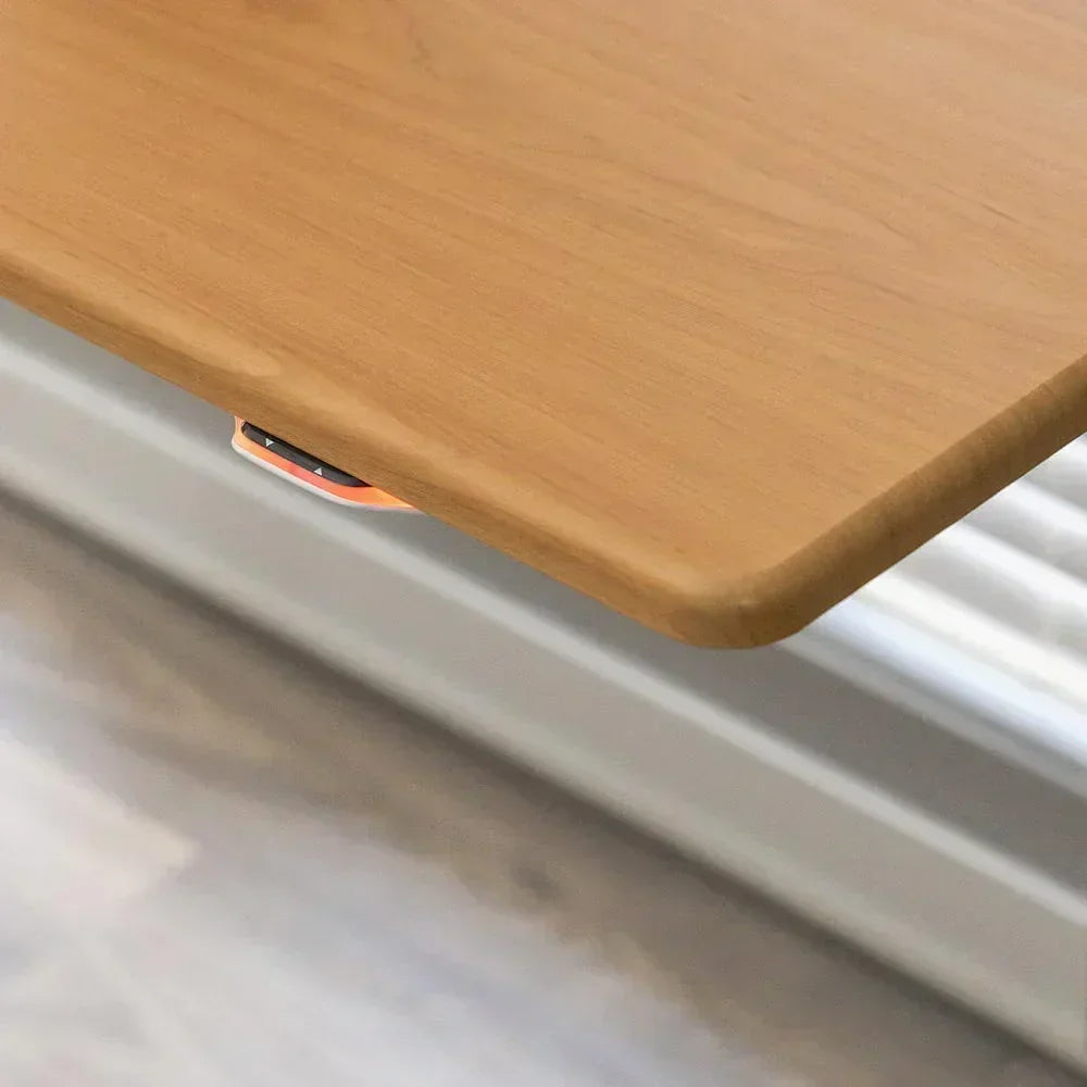 Jaxson Standing Desk, Almond Cherry Top, Handset Corner Detail