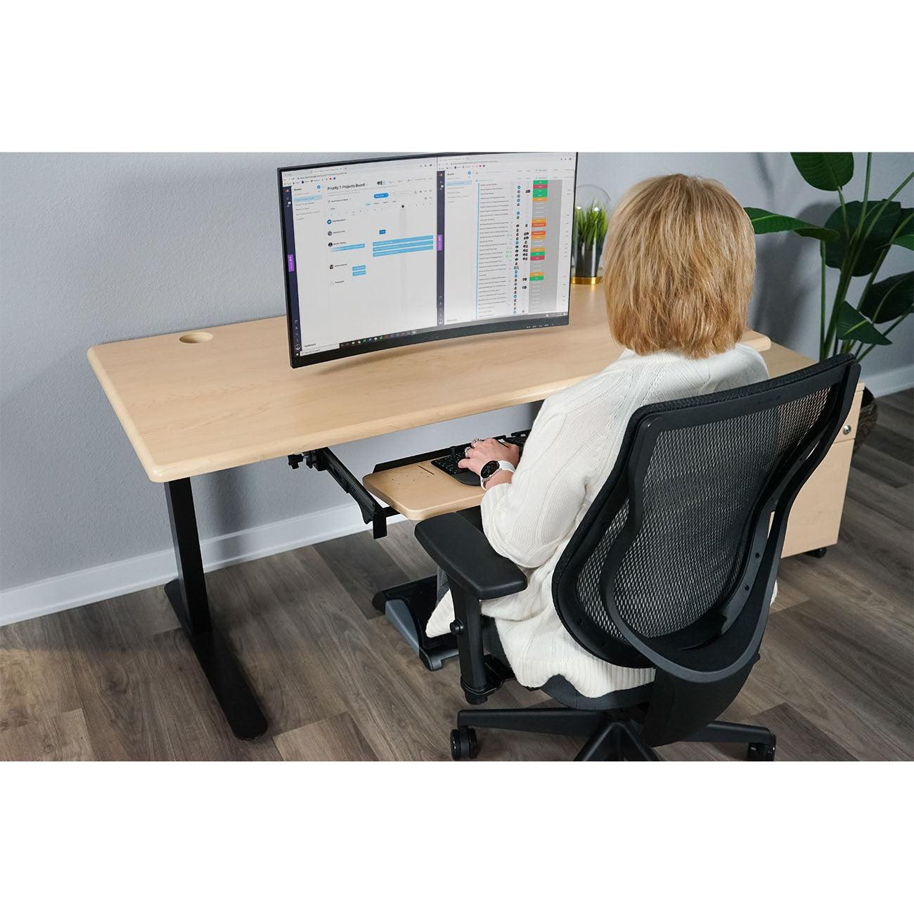 The Lander Desk in Light Maple, shown with optional SteadyType Slide.