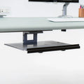 Black Tech Dock under-desk storage for laptops, featuring a perforated surface and front lip.