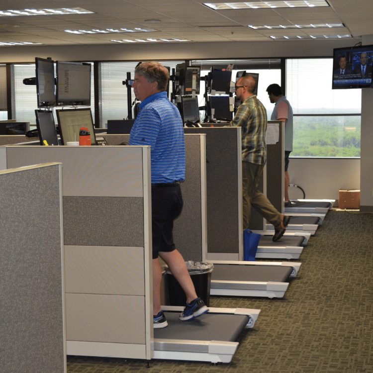 unsit desk treadmill in office setting