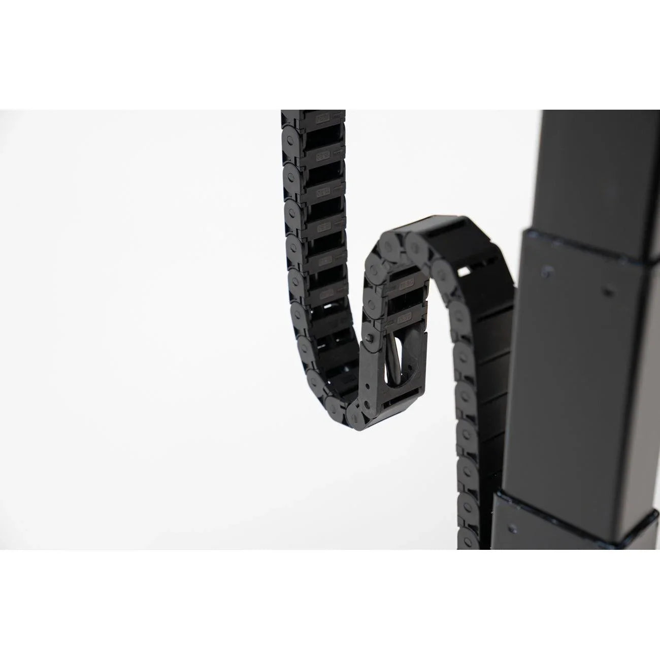 Tucker Cable Chain shown against desk leg.