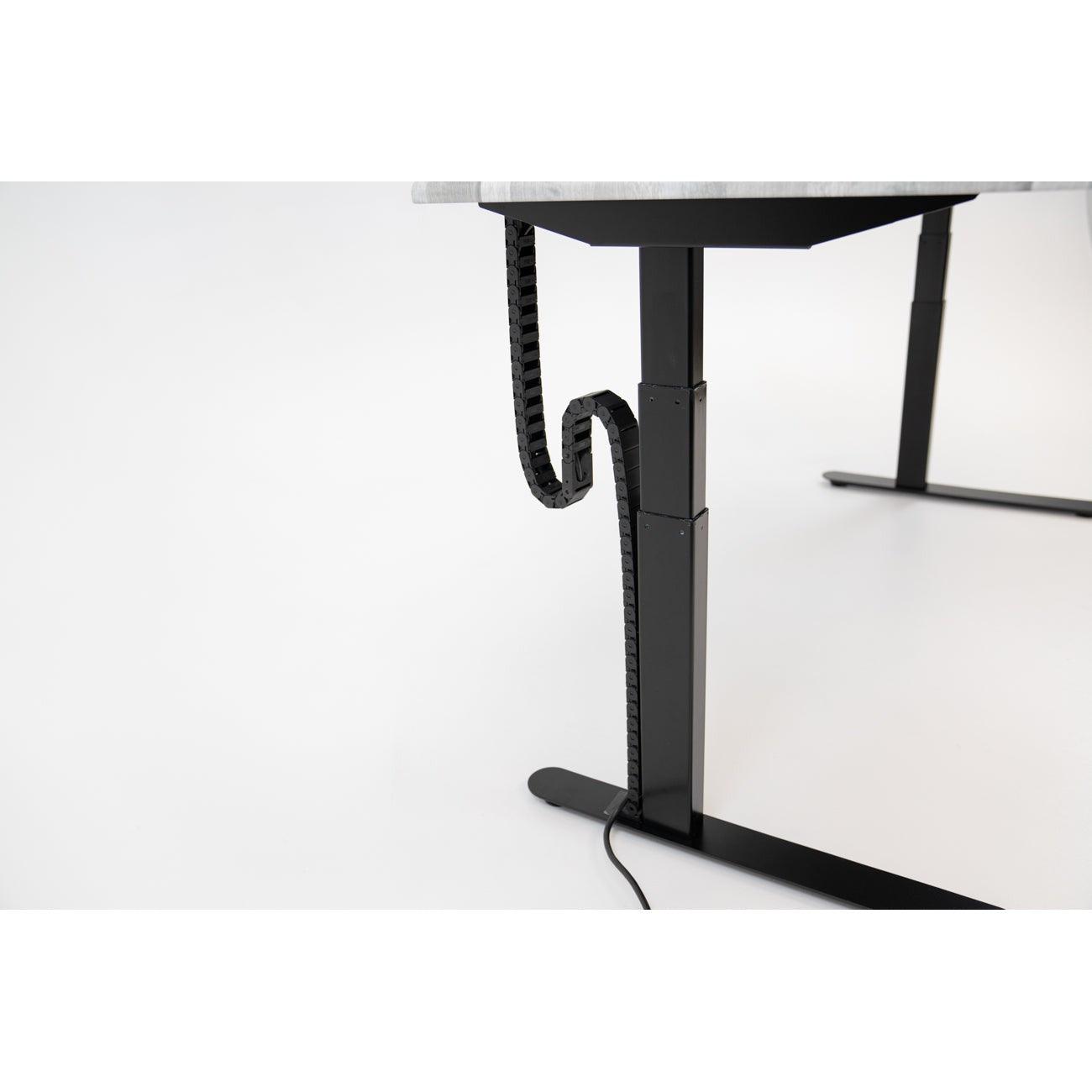 Desk at standing height with Tucker Cable Chain installed.