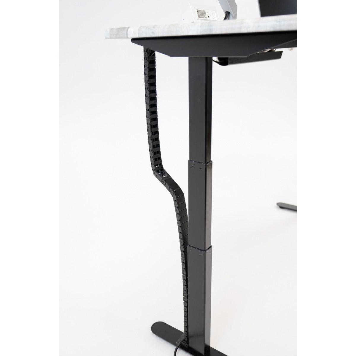 Desk at maxiumum height with Tucker Cable Chain installed.