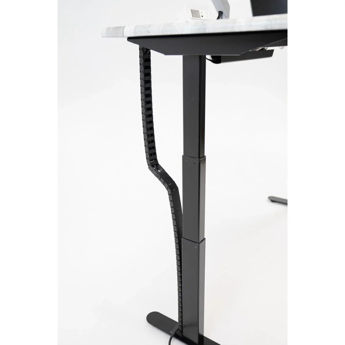 Desk at maxiumum height with Tucker Cable Chain installed.